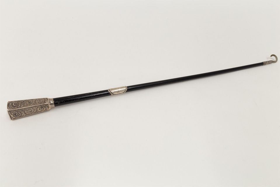 A black presentation baton.